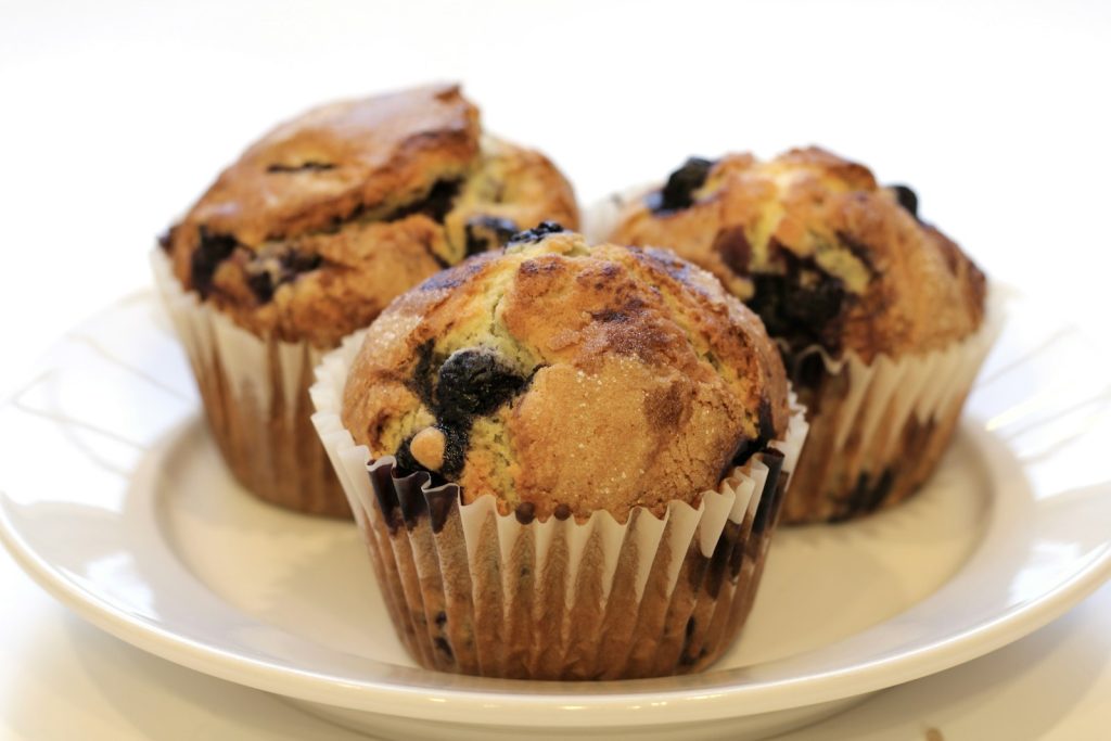 Blueberry muffins on a white plate