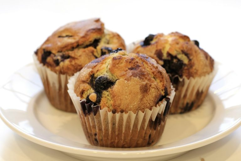 Blueberry muffins on a white plate