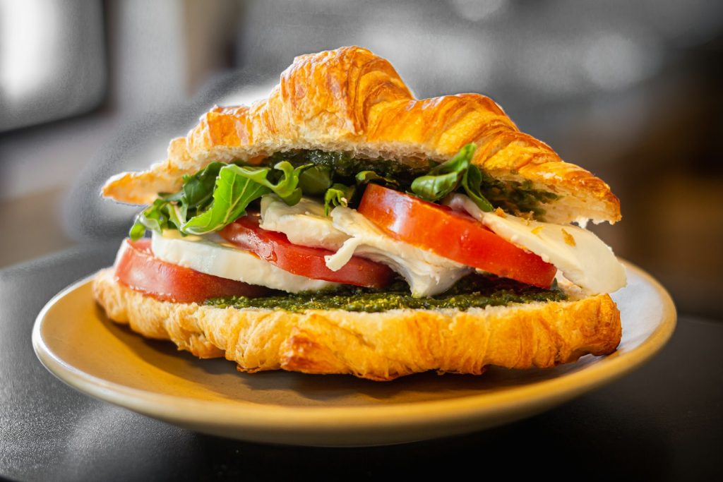 Sandwich with tomato, cheese and greens