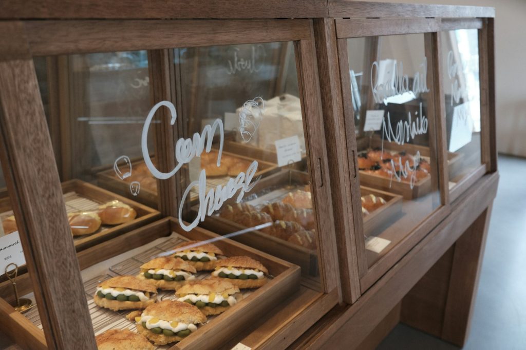 Bakery display case with fresh bread and pastries