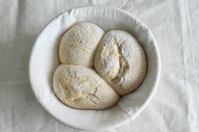 Bread dough proofing in a bowl